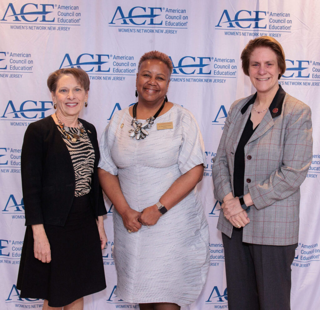 Three NJ college presidents smiling in front of NJ ACE backdrop